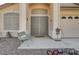 Elegant front entrance with a secure metal gate, decorative accents, and a cozy bench at 5419 Sharpei Ct, Las Vegas, NV 89131