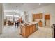 Bright kitchen features an island, tile flooring, and appliances at 5419 Sharpei Ct, Las Vegas, NV 89131
