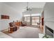 Spacious living room with high ceilings, fireplace, and plenty of natural light at 5419 Sharpei Ct, Las Vegas, NV 89131