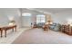 Expansive living area with neutral tones, a large window, and a vaulted ceiling at 5419 Sharpei Ct, Las Vegas, NV 89131