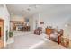 Open-concept living room with a fireplace and access to kitchen and dining area at 5419 Sharpei Ct, Las Vegas, NV 89131