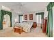 Bright primary bedroom features a ceiling fan and ensuite bath access at 5419 Sharpei Ct, Las Vegas, NV 89131