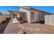 An outdoor patio features a covered seating area with neutral colors at 5419 Sharpei Ct, Las Vegas, NV 89131