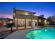 Exterior view of the backyard featuring an in-ground pool and covered patio at 5690 N Park St, Las Vegas, NV 89149