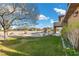 Enjoy the green backyard featuring a pool and desert landscaping at 5690 N Park St, Las Vegas, NV 89149