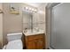 Small bathroom with frosted glass shower and oak vanity at 5690 N Park St, Las Vegas, NV 89149