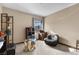 Small bedroom with whimsical table in foreground and view to mountains at 5690 N Park St, Las Vegas, NV 89149