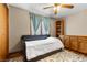 Spare bedroom with daybed, overhead fan, and hardwood flooring at 5690 N Park St, Las Vegas, NV 89149