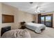 Spacious bedroom with a large window and modern ceiling fan at 5690 N Park St, Las Vegas, NV 89149