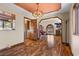Open-concept dining area with hardwood floors and views into the living room at 5690 N Park St, Las Vegas, NV 89149