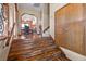 Entryway featuring hardwood stairs and view of kitchen at 5690 N Park St, Las Vegas, NV 89149