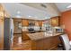 Spacious kitchen with granite countertops, stainless steel appliances, and wooden cabinets at 5690 N Park St, Las Vegas, NV 89149