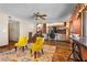 Open living space with hardwood floors, seating area, and stairs leading to a loft at 5690 N Park St, Las Vegas, NV 89149