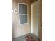 Close up of a unit front door and screen, located on an exterior walkway, with unit number visible at 5751 E Hacienda Ave # 159, Las Vegas, NV 89122