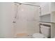 Bathroom showcasing a glass-enclosed shower and built-in shelving for optimal storage and style at 5771 Ritter Ln, Las Vegas, NV 89118