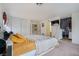 Cozy bedroom showcasing a plush bed, neutral tones, and an adjacent walk-in closet at 5771 Ritter Ln, Las Vegas, NV 89118