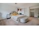 Bedroom featuring a well-lit space, an inviting bed, and cozy accents and decor at 5771 Ritter Ln, Las Vegas, NV 89118