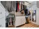 Walk in closet featuring custom shelving, cabinets and rods for maximal organization at 5771 Ritter Ln, Las Vegas, NV 89118