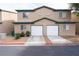 Well-maintained home featuring two garages and desert landscaping for a clean, appealing look at 5771 Ritter Ln, Las Vegas, NV 89118