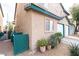 Exterior view of a well-kept home with a garage and colorful landscaping at 5771 Ritter Ln, Las Vegas, NV 89118