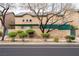Property facade featuring mature trees and manicured bushes at 5771 Ritter Ln, Las Vegas, NV 89118
