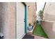 Inviting front entrance with a well-maintained door, exterior lighting, and landscaping at 5771 Ritter Ln, Las Vegas, NV 89118