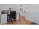 Functional office space with a large desk, filing cabinets, and views of the landing at 5771 Ritter Ln, Las Vegas, NV 89118