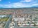Wide aerial view showcasing the home's location within a sprawling desert community at 6405 Break Point Ave, Las Vegas, NV 89130