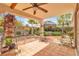 Beautifully landscaped backyard featuring a covered patio and lush greenery for ultimate relaxation at 6405 Break Point Ave, Las Vegas, NV 89130