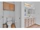 Bathroom featuring a toilet and large vanity and ample storage at 6405 Break Point Ave, Las Vegas, NV 89130