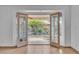 Inviting double doors leading to a serene backyard, enhancing the indoor-outdoor living experience at 6405 Break Point Ave, Las Vegas, NV 89130