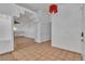 Welcoming entryway with neutral tile flooring, staircase feature, and decorative light fixture at 6405 Break Point Ave, Las Vegas, NV 89130