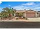 Charming single-story home with a two-car garage, mature landscaping, and a welcoming entrance at 6405 Break Point Ave, Las Vegas, NV 89130