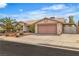 Well-maintained single-story home with mature landscaping, a two-car garage, and gated parking at 6405 Break Point Ave, Las Vegas, NV 89130