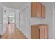 Hallway with storage cabinets and neutral floors, offering functionality and accessibility at 6405 Break Point Ave, Las Vegas, NV 89130