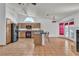 Well-lit kitchen with breakfast bar, appliances, and open view to the adjacent dining and living areas at 6405 Break Point Ave, Las Vegas, NV 89130