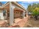 Extensive covered patio with outdoor kitchen, perfect for entertaining in the landscaped backyard at 6405 Break Point Ave, Las Vegas, NV 89130