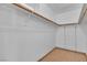 Spacious walk-in closet with shelving and ample storage space for an organized wardrobe at 6405 Break Point Ave, Las Vegas, NV 89130