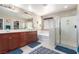 Bright primary bath featuring dual sinks, a soaking tub, and a separate glass shower at 6476 Little Harbor Ct, Las Vegas, NV 89141