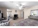Primary bedroom suite featuring a decorative ceiling fan and access to an ensuite bathroom at 6476 Little Harbor Ct, Las Vegas, NV 89141