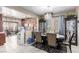 Well-lit dining room boasts tile flooring and an open concept layout, perfect for entertaining and everyday living at 6476 Little Harbor Ct, Las Vegas, NV 89141