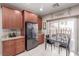 Functional kitchen featuring stainless steel appliances, a dining table, and plenty of cabinet and counter space at 6476 Little Harbor Ct, Las Vegas, NV 89141