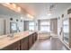 The primary bathroom boasts a double sink vanity and large soaking tub with tile surround at 6484 Mount Eden Ave, Las Vegas, NV 89139