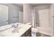Well-lit bathroom featuring a sleek vanity, modern fixtures, and a shower-tub combination at 6484 Mount Eden Ave, Las Vegas, NV 89139