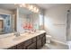 Bathroom with double sinks and a large mirror at 6484 Mount Eden Ave, Las Vegas, NV 89139