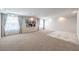 Expansive bonus room with large windows, neutral carpet, and space for multiple seating and recreational areas at 6484 Mount Eden Ave, Las Vegas, NV 89139