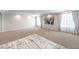 Large bonus room with plush carpeting, ample lighting, and decorative accents, creating a flexible living area at 6484 Mount Eden Ave, Las Vegas, NV 89139