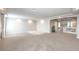 Spacious living room featuring neutral walls and plush carpeting, perfect for relaxation and entertaining at 6484 Mount Eden Ave, Las Vegas, NV 89139