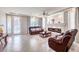 Inviting living room featuring a fireplace, tile floors, and leather furniture at 6484 Mount Eden Ave, Las Vegas, NV 89139