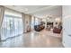 Bright living room with tile floors, sliding glass doors, and comfortable seating at 6484 Mount Eden Ave, Las Vegas, NV 89139